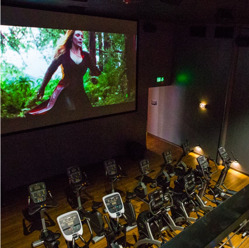 Treadmills lined up inside of Edge Cinema. 